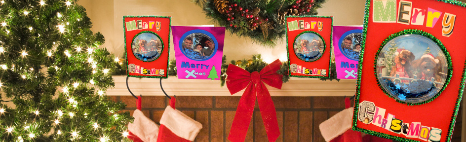 Blue Peter Christmas card on a fireplace with stockings and christmas tree