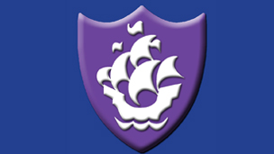 A purple Blue Peter badge