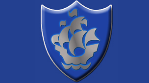 A silver Blue Peter badge
