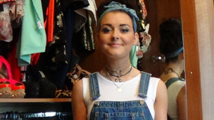 Shannon in front of her wardrobe.