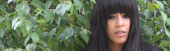 Loreen's top singing tips Loreen in front of a tree.