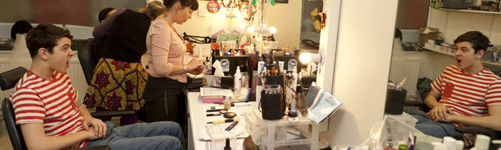 Behind the scenes at Sadie J kit, backstage, looking at his reflection in the mirror