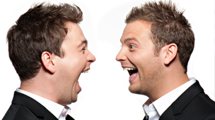 Sam and Mark laughing in each other's faces