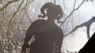 The Satyr watches from the depths of the forest.
