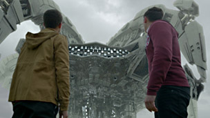 Tom and Benny with Nekross spaceship above them