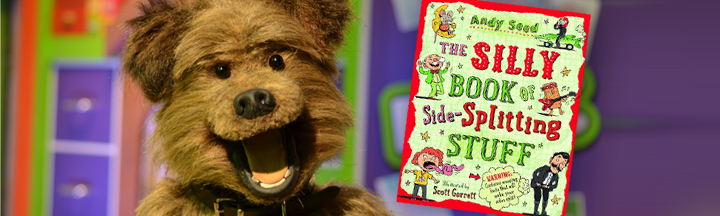Book Club: The Silly Book of Side-Splitting Stuff Hacker in the CBBC office, with the cover art for 'The Silly Book of Side-Splitting Stuff'.