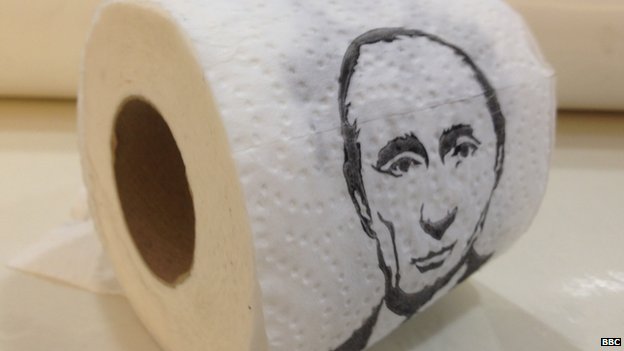 A toilet roll featuring pictures of Vladimir Putin